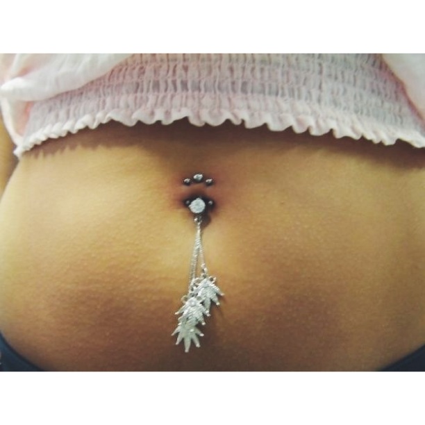 Double Navel Piercing either side of existing [standard] Navel Piercing.