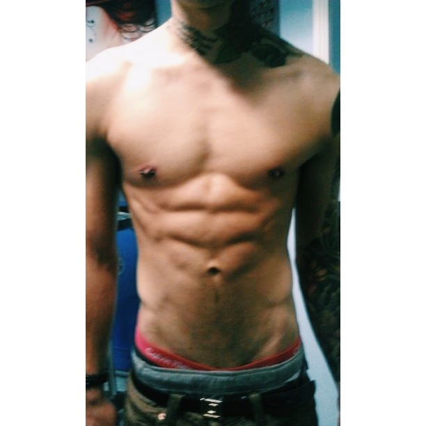 Pair of Nipples, pierced with Blackline Titanium.