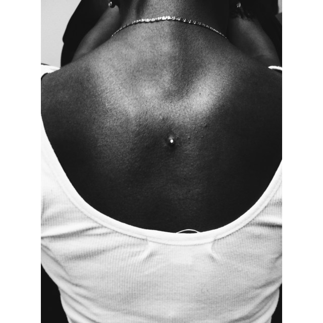 Dermal Anchor between the shoulder blades.