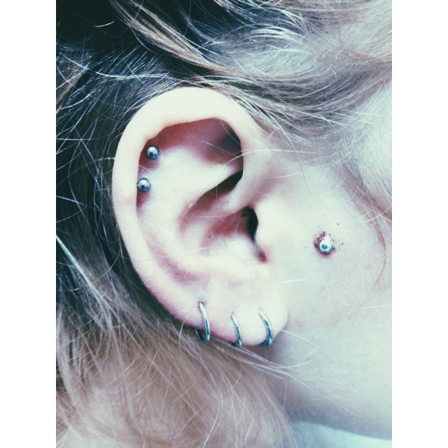 Terri's Double Top Ear Piercings & Face Dermal