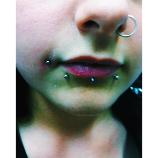 Layla. Two furthest left lip piercings and nose, pierced by El Capitan.